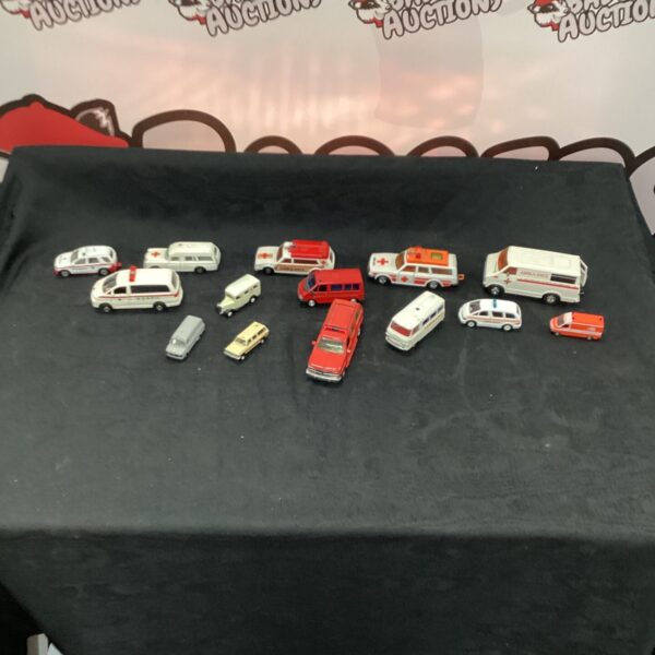 Selection of vintage diecast model ambulances for collectors.