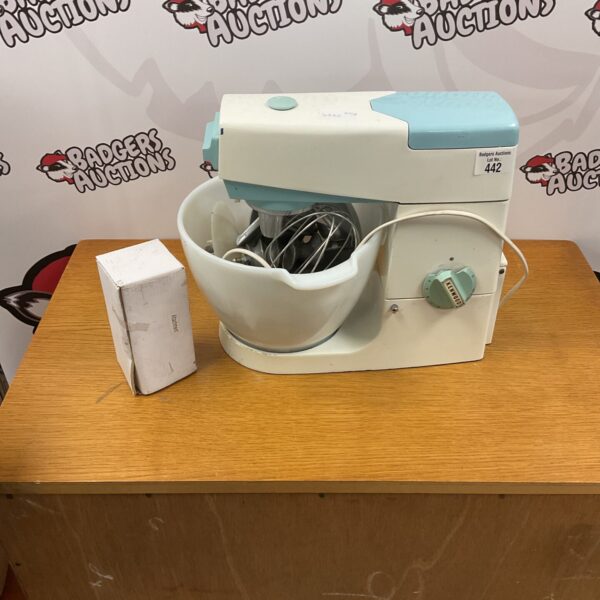 Vintage Kenwood A701 food mixer with attachments for baking.