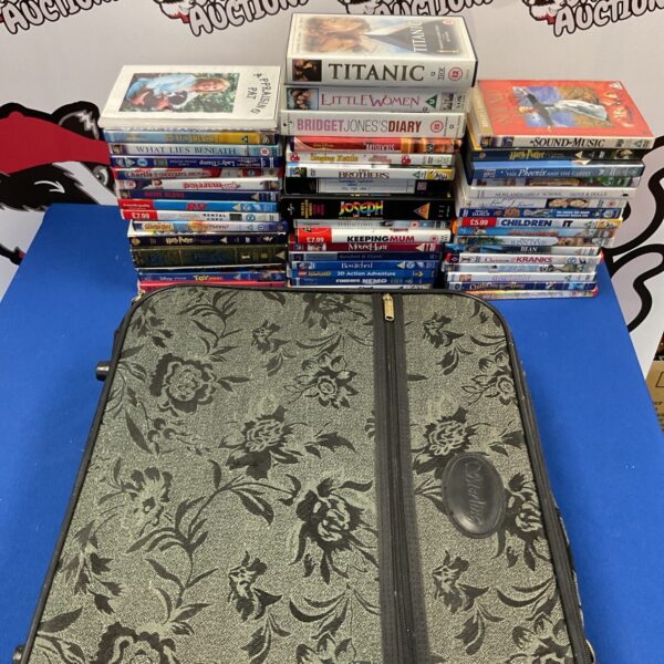 Large lot of DVDs and VHS tapes including Harry Potter and Titanic.