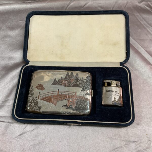 Open vintage Japanese silver cigarette case and lighter set in presentation box.