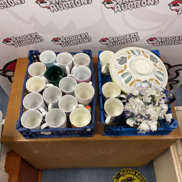Two crates inc crate of mixed mugs and crate of watering can with flowers, floral bowl