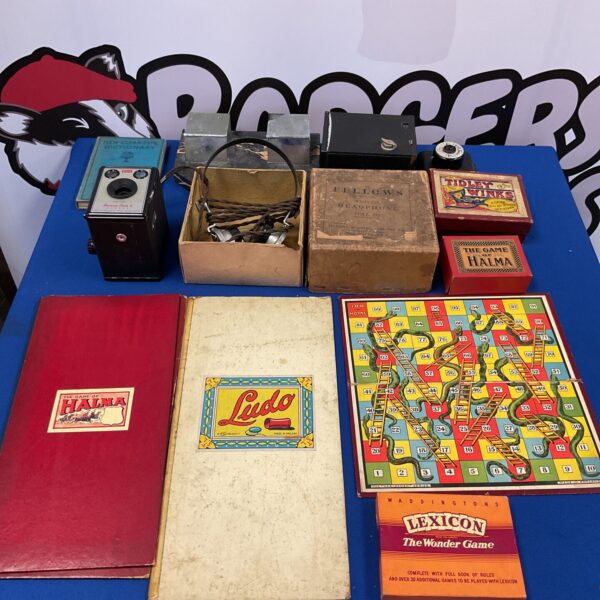 Vintage board games, camera, headphones and inkwell in a lot.