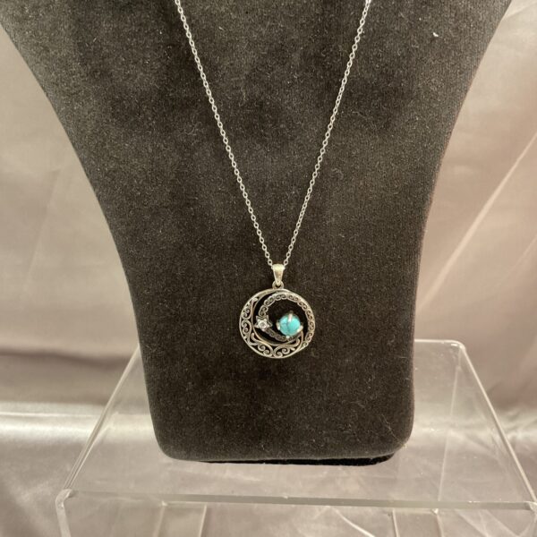 Silver aquamarine pendant necklace on a delicate chain.