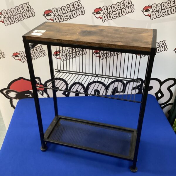 Dark metal side table with wire rack shelves.