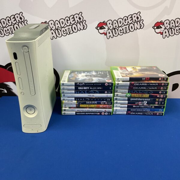 Black Xbox 360 console with a collection of games.
