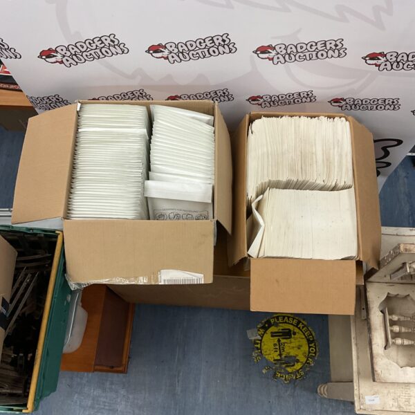 Lot of sealed Jiffy bags and paper envelopes for mailing.