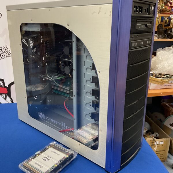 Front view of Cooler Master PC tower with components visible.