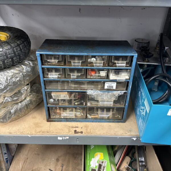 Vintage Raaco engineers cabinet filled with small parts and tools.