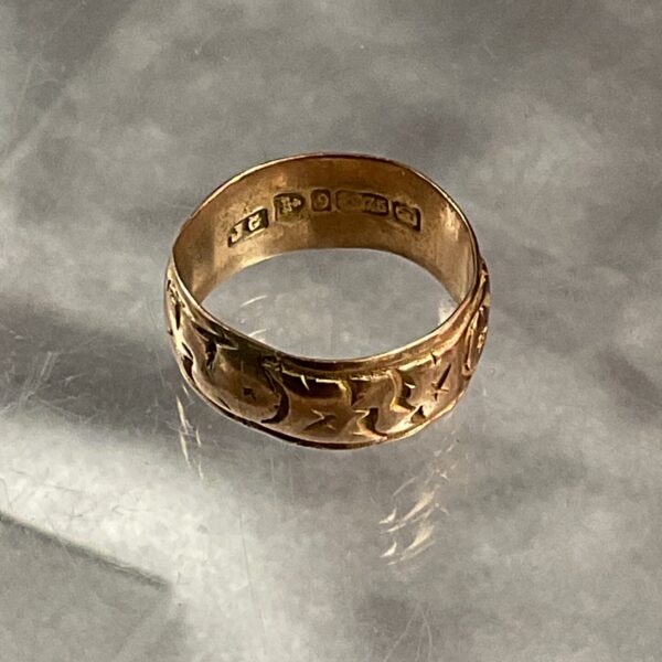 Delicate 9ct rose gold band ring, classic jewellery design.