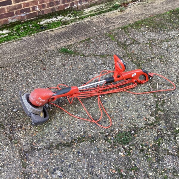 Used Flymo electric strimmer for garden maintenance.