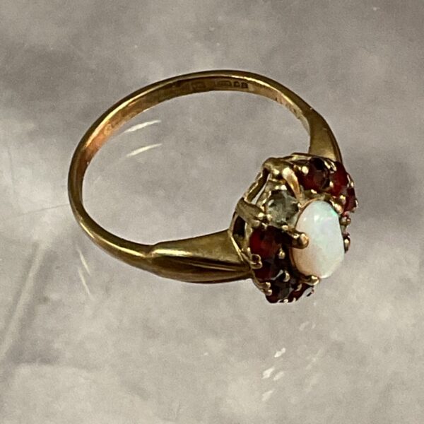 Vintage 9ct gold ring with opal and red stones.