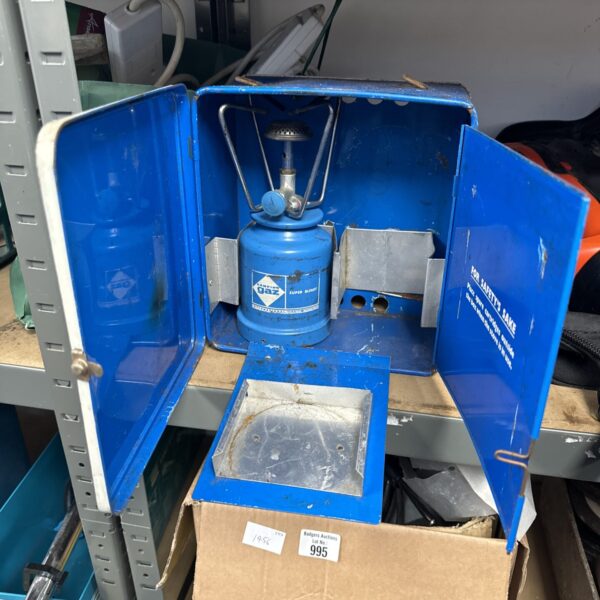 Blue enamel Camping Gaz stove for outdoor cooking.