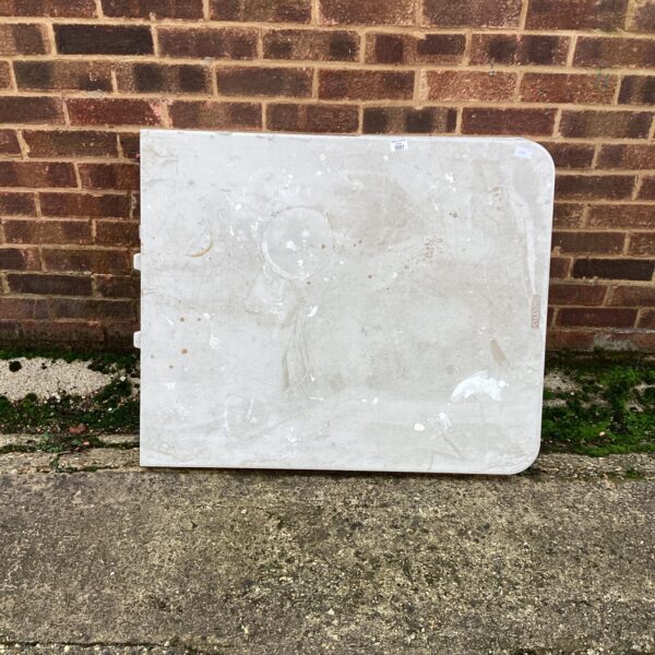 White plastic Lifetime folding table, showing signs of wear.
