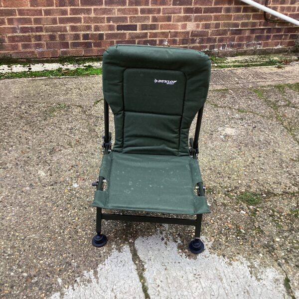 Front view of a green Dunlop anglers chair for fishing.