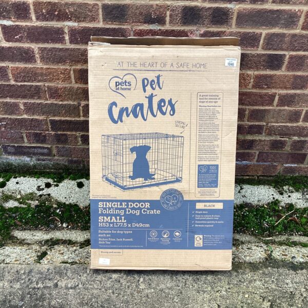 Pets at Home folding dog crate, providing a secure and portable space for dogs.