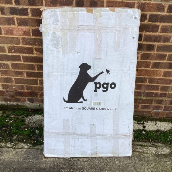 Unopened dog pen box, ready for assembly and pet use.