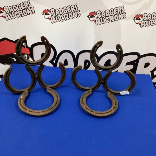 Vintage horseshoe pair for garden decor and boot scraping.