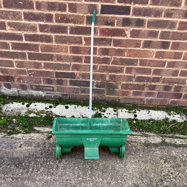 Vintage green Evergreen Maxi lawn feed spreader for garden use.