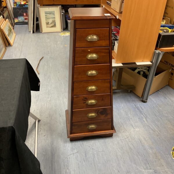 Antique mahogany chest of drawers with pyramid stepped design.