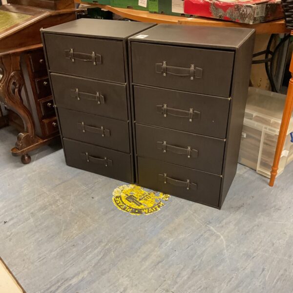 Vintage black leather drawers set for storage and organization.