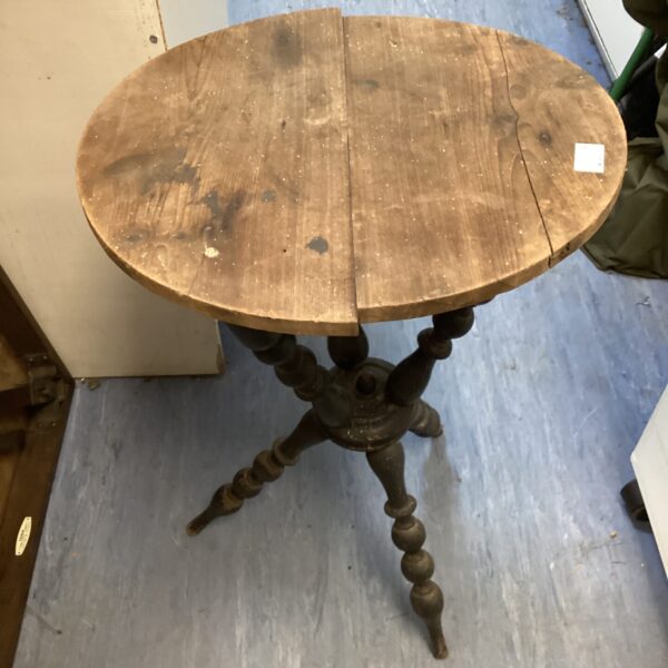 Antique bobbin table with tripod legs and circular top.