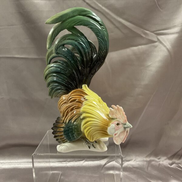 Vibrant Karl Ens ceramic cockerel with detailed tail feathers.