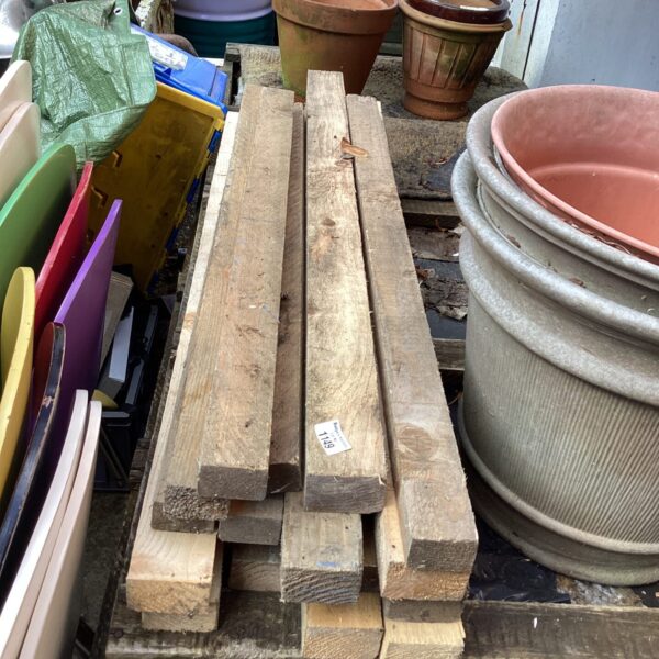 Stack of rough sawn timber planks for DIY projects.