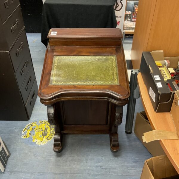 Vintage mahogany davenport desk with green leather top.