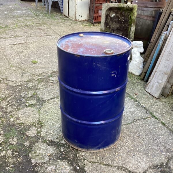 Large blue empty oil drum for storage or repurposing.