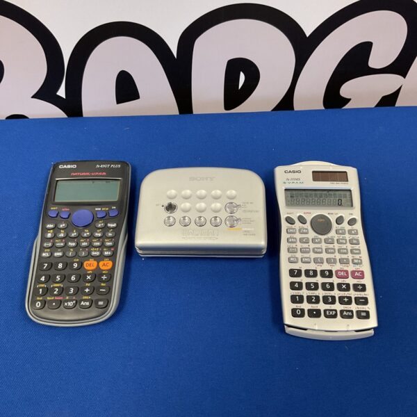 Vintage electronics lot featuring Sony Walkman and Casio calculators.