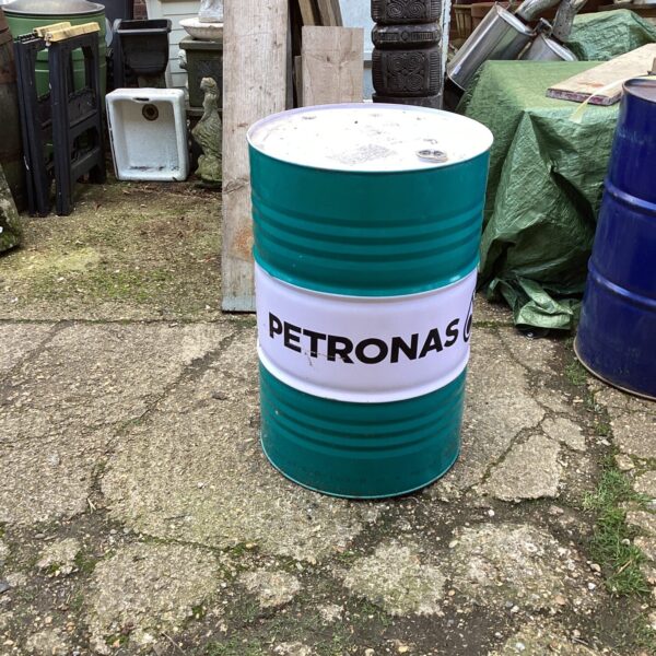 Front view of a vintage Petronas oil drum.