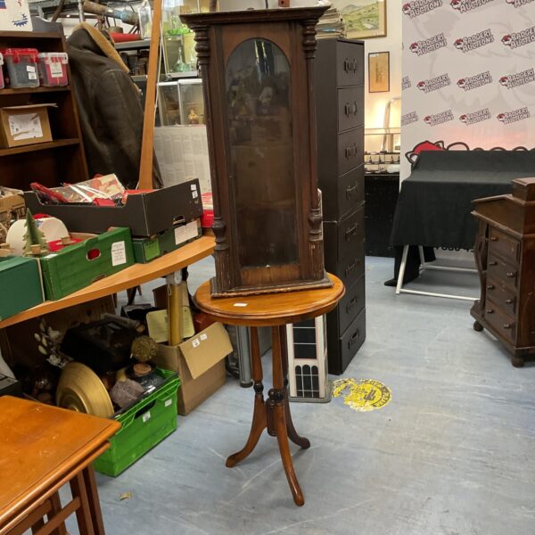 Antique Empire mahogany side table and vintage glass clock cabinet.