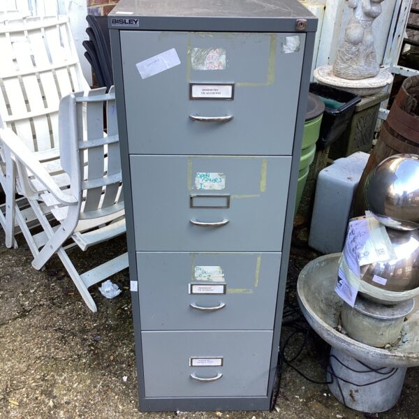 Vintage Bisley filing cabinet with four drawers, showing signs of wear.
