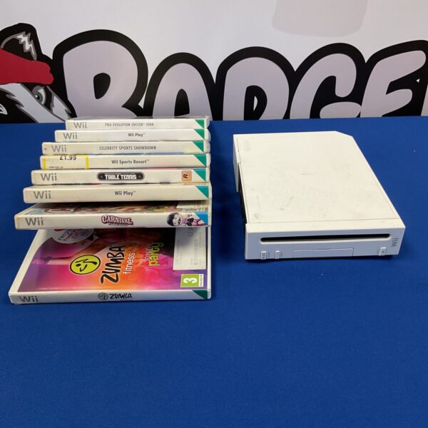 Nintendo Wii console with games and cables for retro gaming.