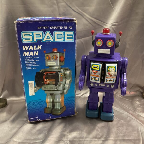 Vintage Space Walk Man robot in original box, collectible tin toy.