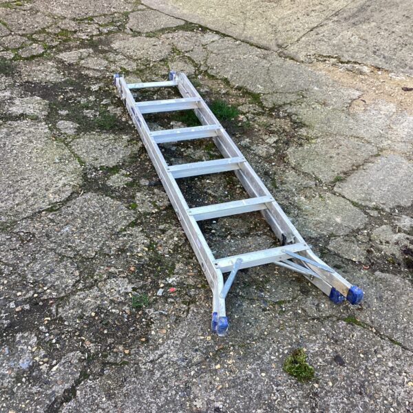 Silver aluminium combination ladder extended for use.