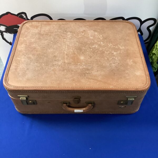 Front view of a vintage Skyway suitcase with a brown hard shell.