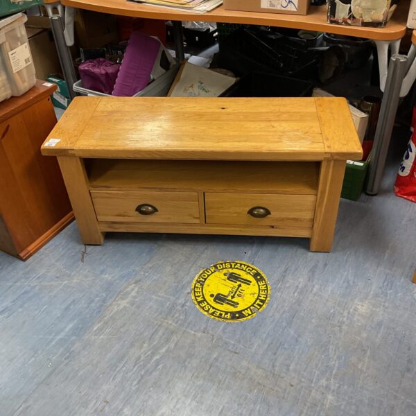 Vintage oak media cabinet with doors, ideal for home entertainment.