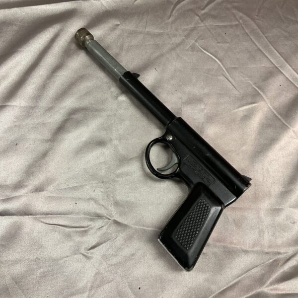 Vintage T J Harrington Gat Gun toy, detailed tinplate design.