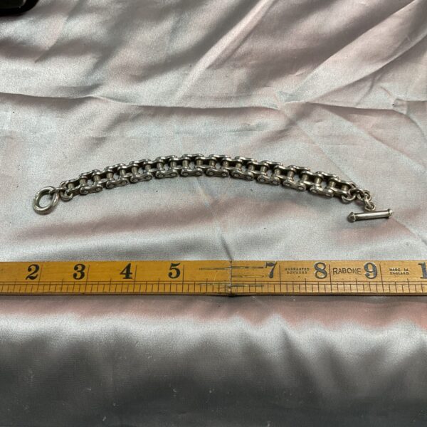 Vintage silver bicycle chain bracelet with T-bar clasp.