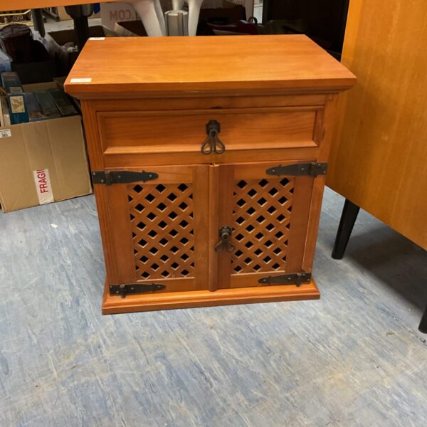 Vintage lattice pine bedside cabinet with decorative door.