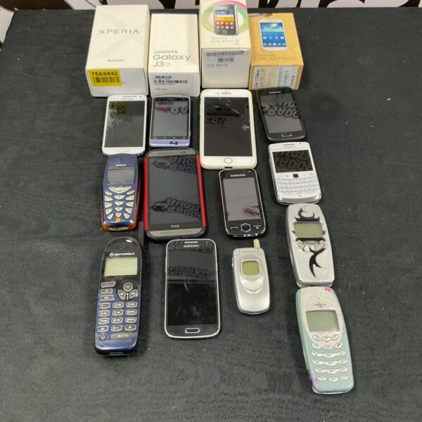 Diverse lot of vintage and modern mobile phones, including Samsung and Nokia.
