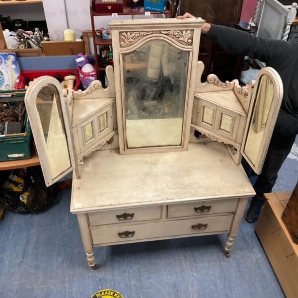 Antique Victorian dressing table mirror with ornate detailing.