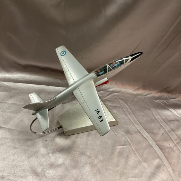 Vintage Pampa Alpha Jet model on display stand.