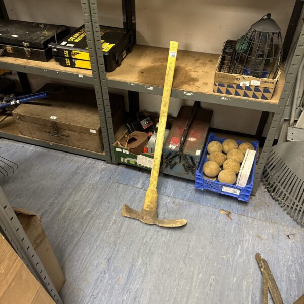 Plastic handled mattock for digging and landscaping.