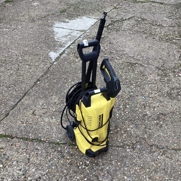 Front view of a yellow Karcher power washer for garden cleaning.
