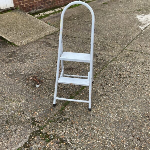 Vintage metal kitchen step ladder for household use.