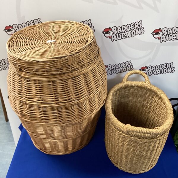 Pair of vintage wicker baskets for laundry and storage.