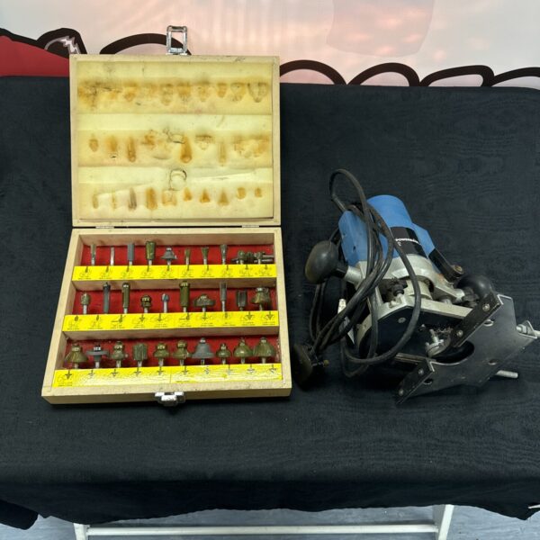 Powerbase router set with Screwfix attachments for woodworking.