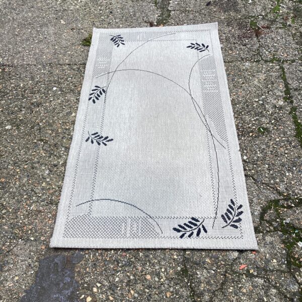 Vintage floral runner rug with a detailed pattern.